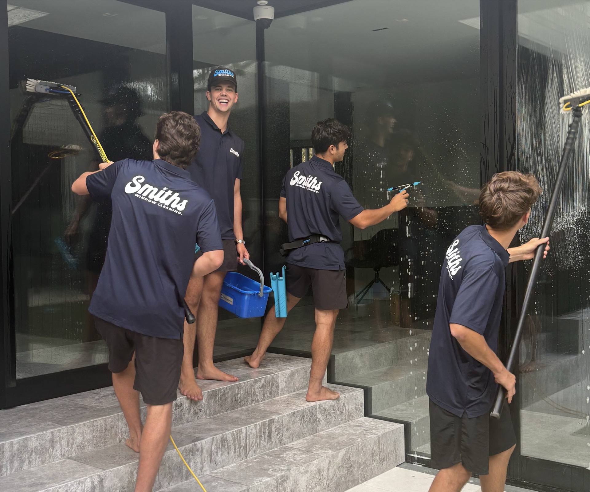 The Smith's Window Cleaning crew cleaning glass on an Auckland commercial job